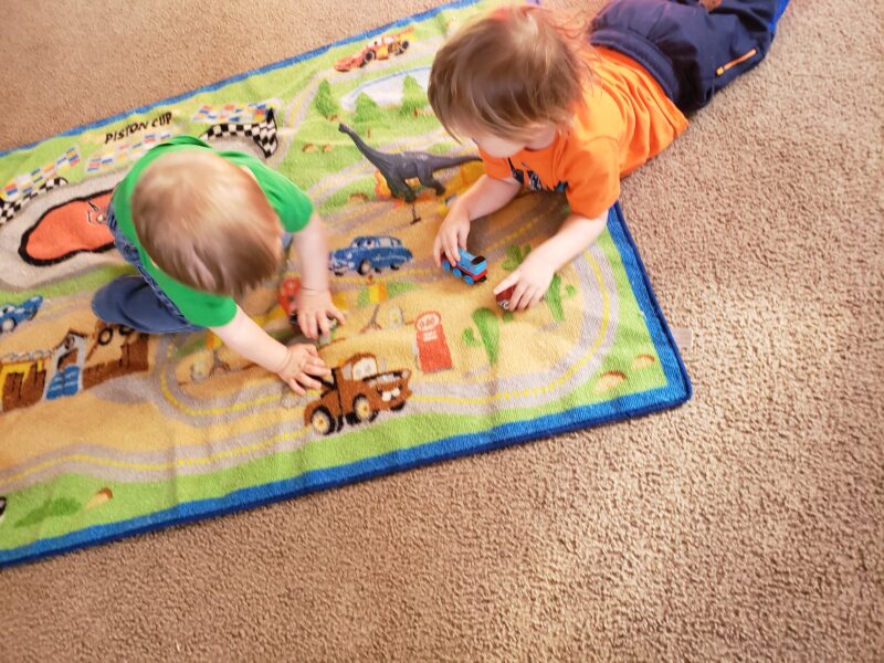 Children playing with toys on the floor