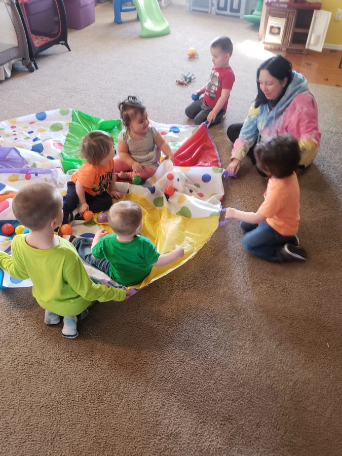 Parachute play activity with Rebel and the kids